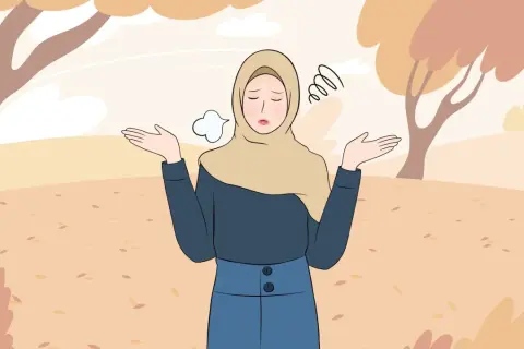 En kvinna i hijab med uppgivet uttryck, omgiven av höstlöv. Hon söker vägen till att vara fri från oro, ångest och fobier.