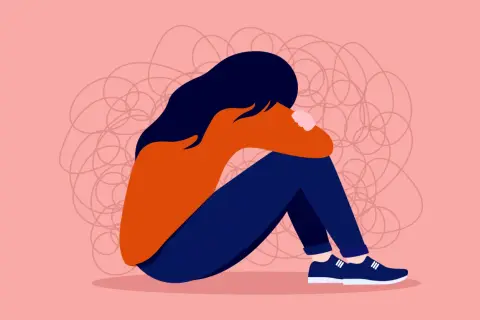 En person sitter hopkrupen, omgiven av trassliga linjer som symboliserar hur det känns när man undrar vad betyder toxic i relationer.