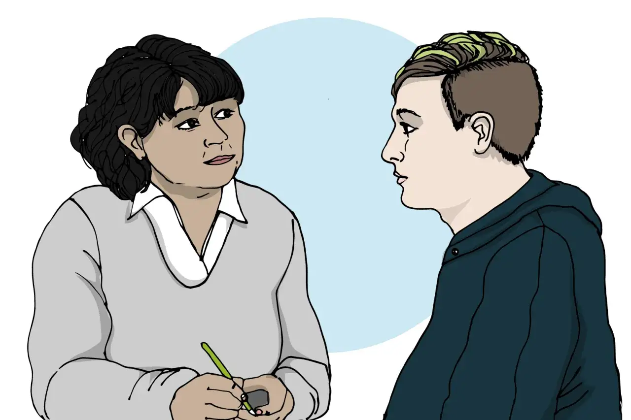 En terapeut lyssnar p&aring; en ung person som visar tecken p&aring; anorexia.